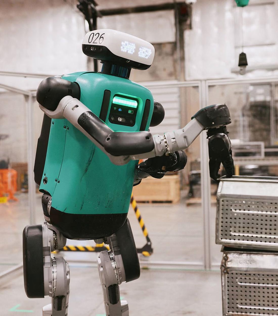Digit handling a stacked tote in a facility. Where: Industrial facility (customer not stated)