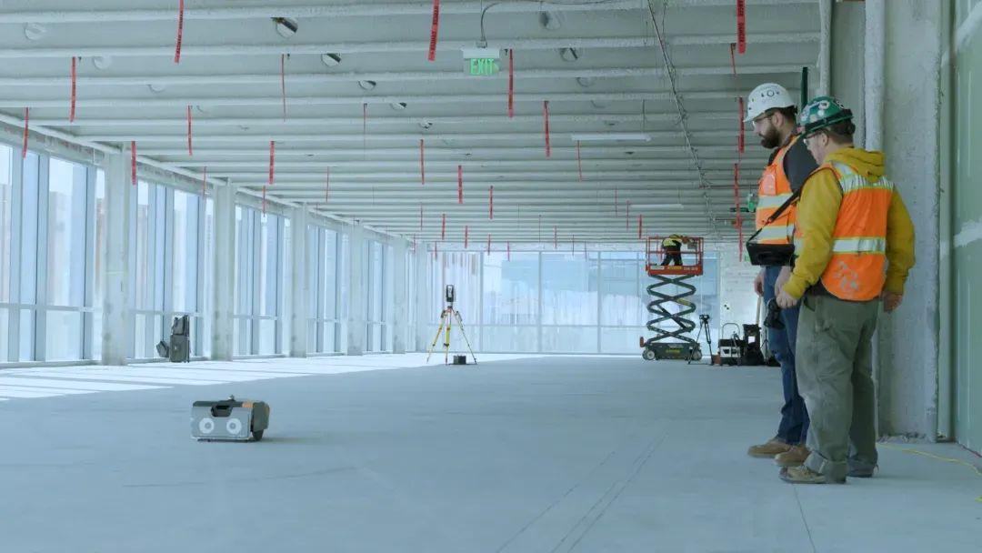 FieldPrinter on an open floor with a site crew. Where: Truebeck life-sciences project (per Dusty alt text)