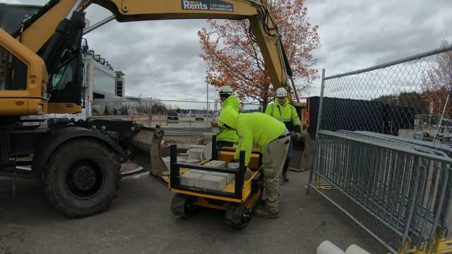 Tracked hauler cart loaded with pavers